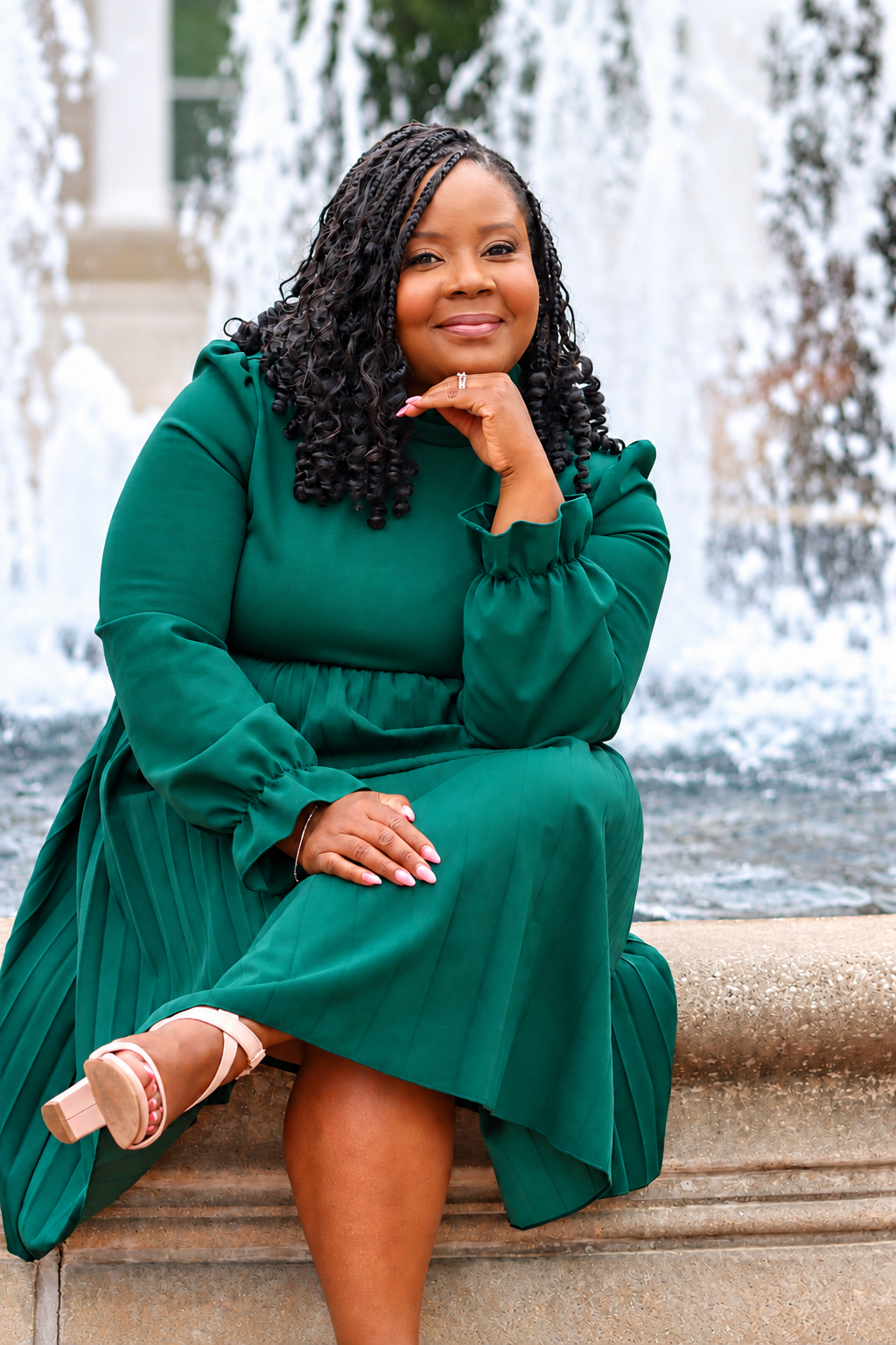 Dr. Sabrina Lee seated by a fountain